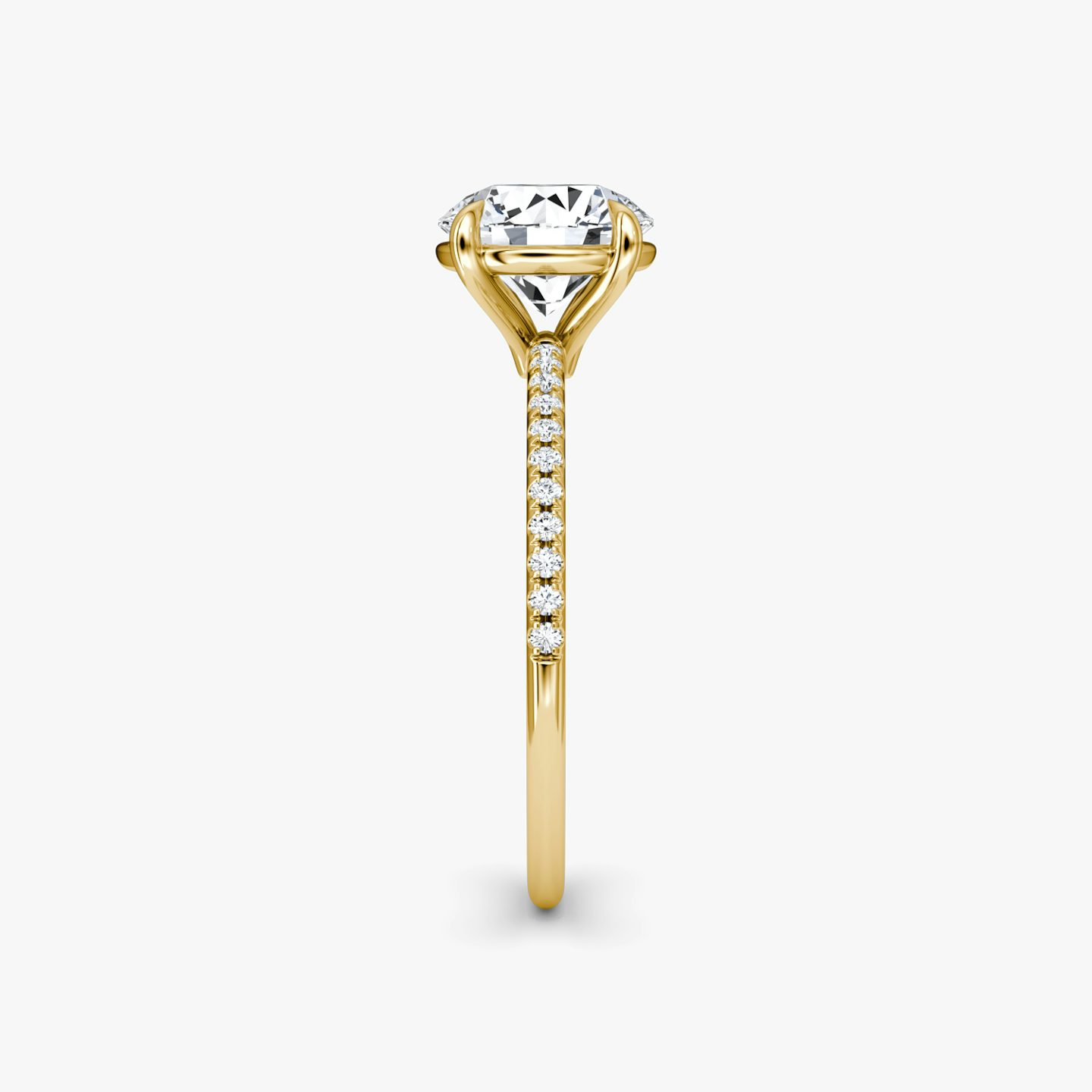 The Petite 4-Prong Solitaire | Round Brilliant | 18k | 18k Yellow Gold | Band: Pavé | Carat weight: See full inventory | Diamond orientation: vertical