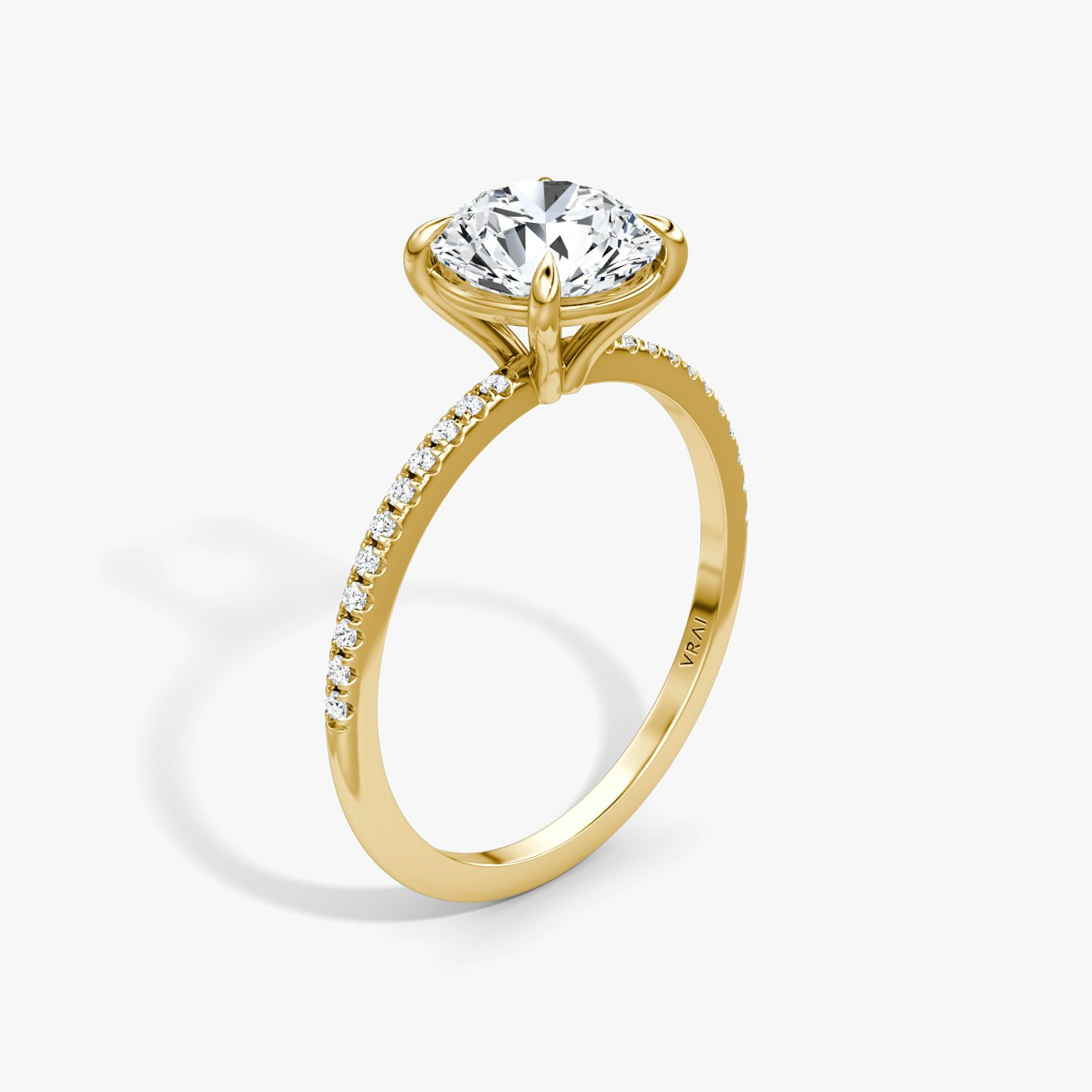 The Petite 4-Prong Solitaire | Round Brilliant | 18k | 18k Yellow Gold | Band: Pavé | Carat weight: See full inventory | Diamond orientation: vertical