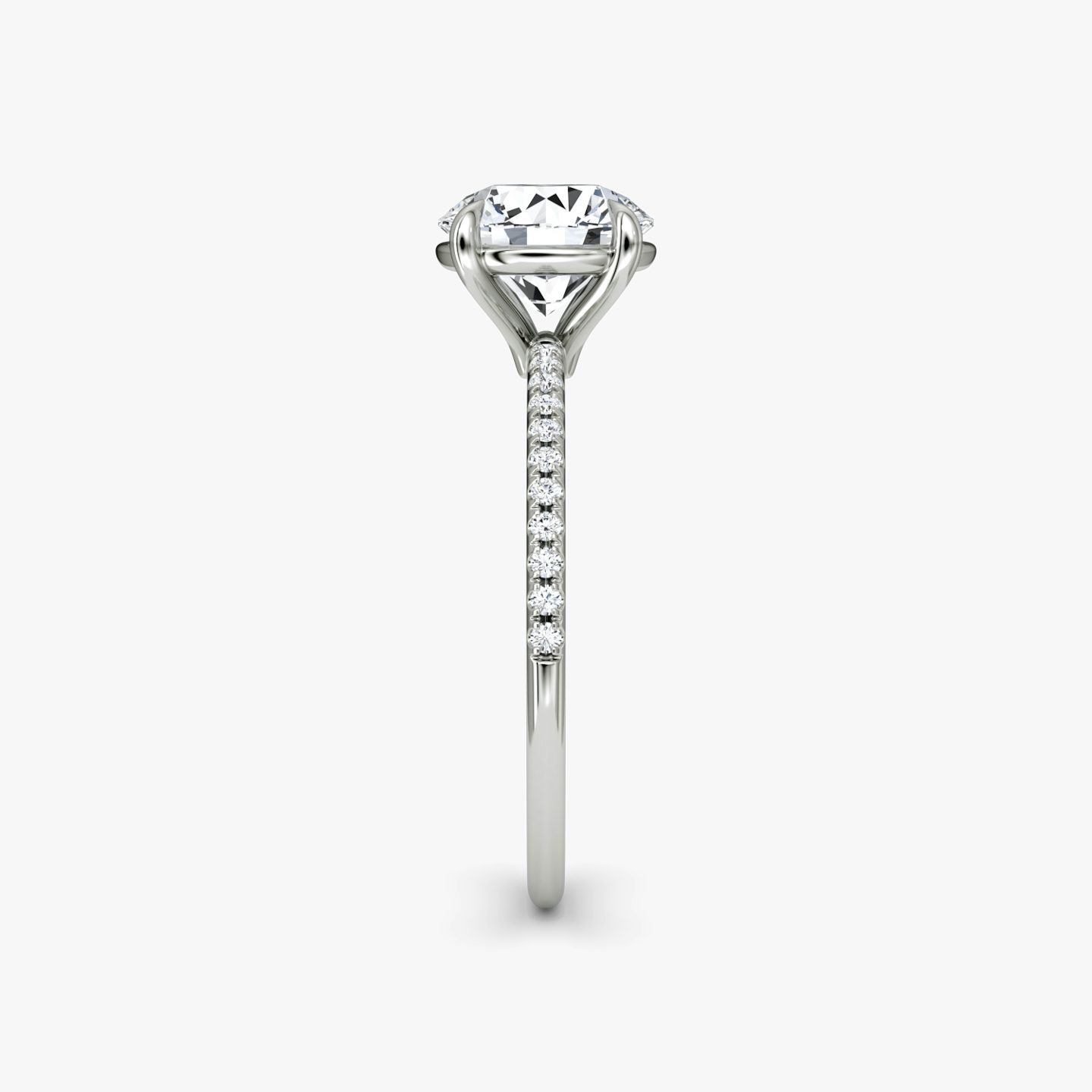 The Petite 4-Prong Solitaire | Round Brilliant | 18k | 18k White Gold | Band: Pavé | Carat weight: See full inventory | Diamond orientation: vertical