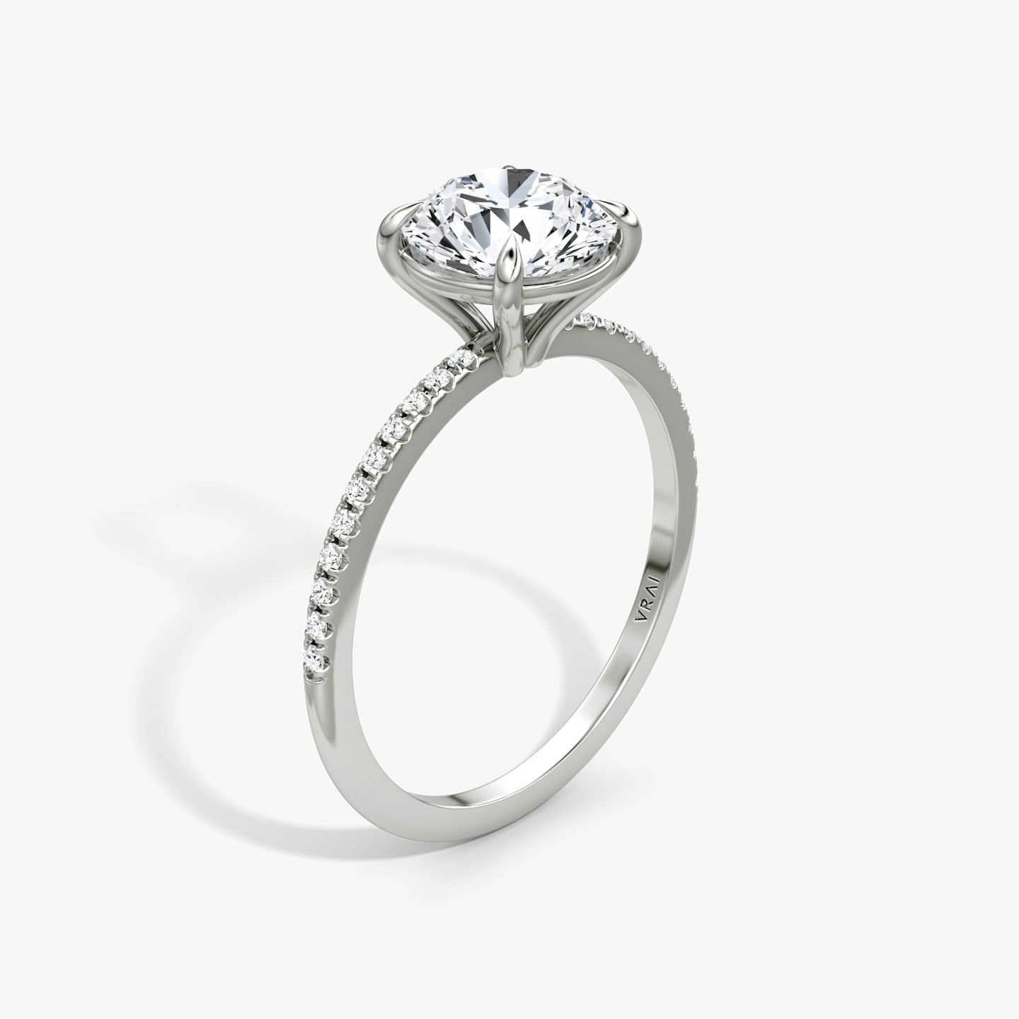 The Petite 4-Prong Solitaire | Round Brilliant | Platinum | Band: Pavé | Carat weight: See full inventory | Diamond orientation: vertical