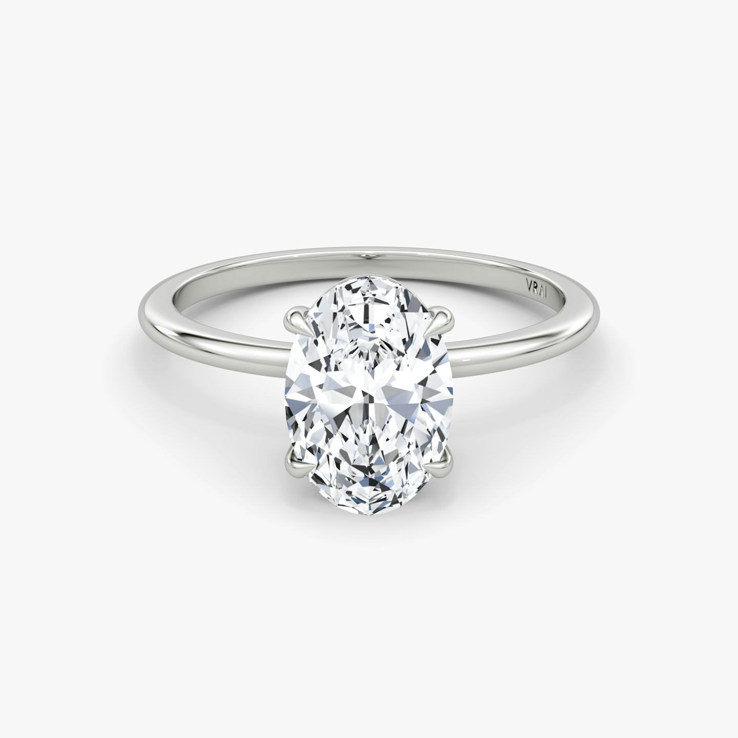 The Petite 4-Prong Solitaire | Oval | Platinum | Band: Plain | Diamond orientation: vertical | Carat weight: See full inventory