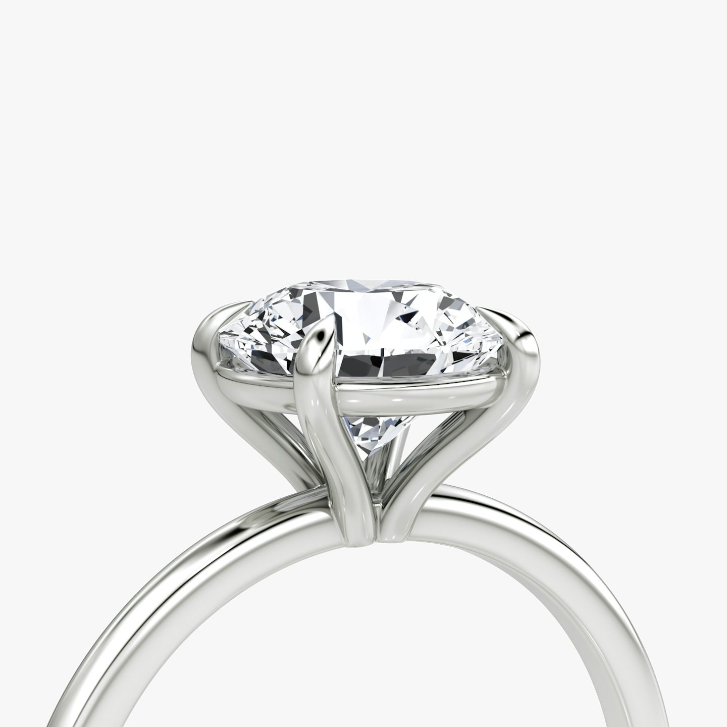 The Petite 4-Prong Solitaire | Round Brilliant | Platinum | Band: Plain | Carat weight: See full inventory | Diamond orientation: vertical