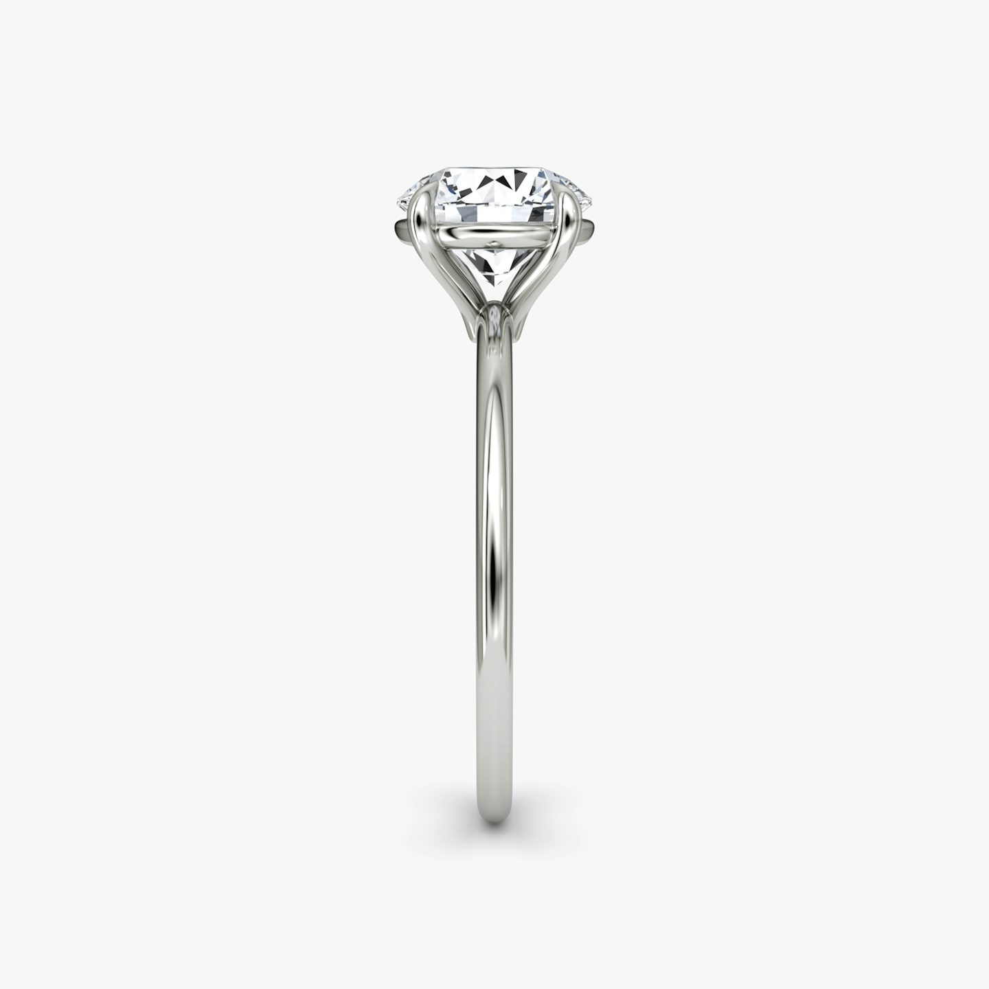 The Petite 4-Prong Solitaire | Round Brilliant | Platinum | Band: Plain | Carat weight: See full inventory | Diamond orientation: vertical