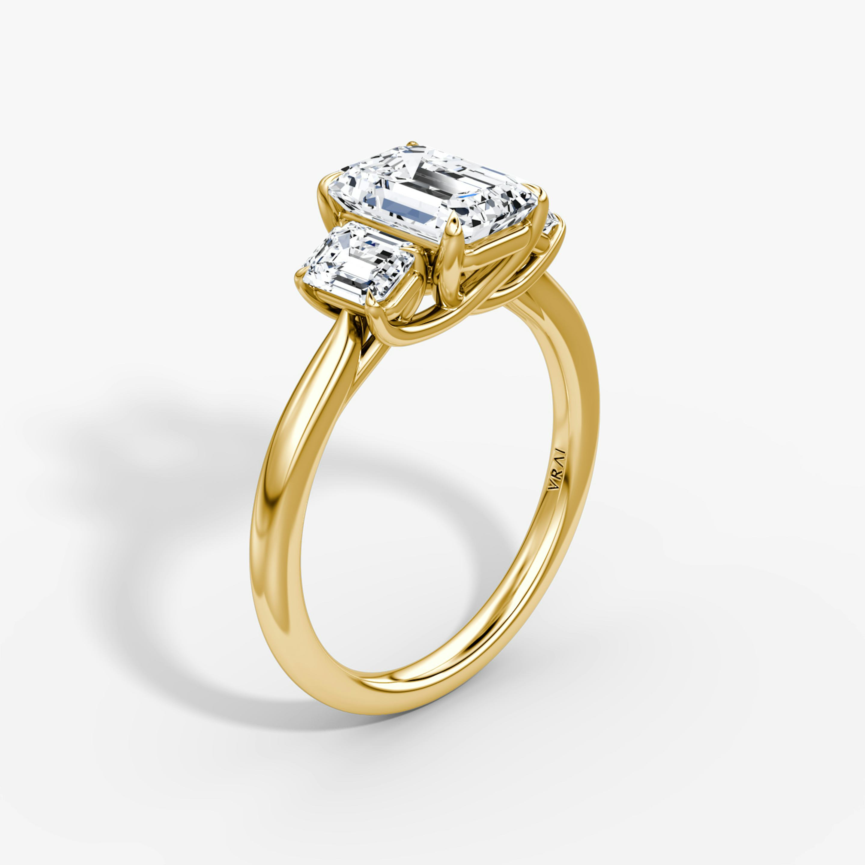 The Trellis Three Stone | Emerald | 18k | 18k Yellow Gold | Band: Plain | Diamond orientation: vertical | Carat weight: See full inventory