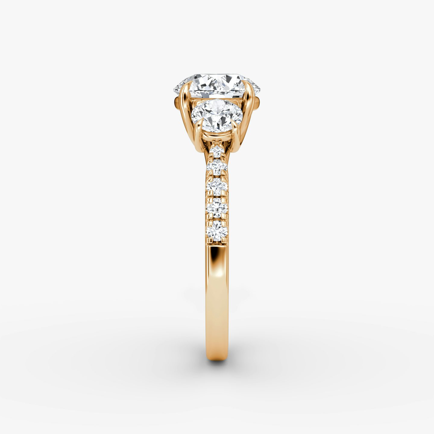 The Trellis Three Stone | Round Brilliant | 14k | 14k Rose Gold | Band: Pavé | Carat weight: See full inventory | Diamond orientation: vertical