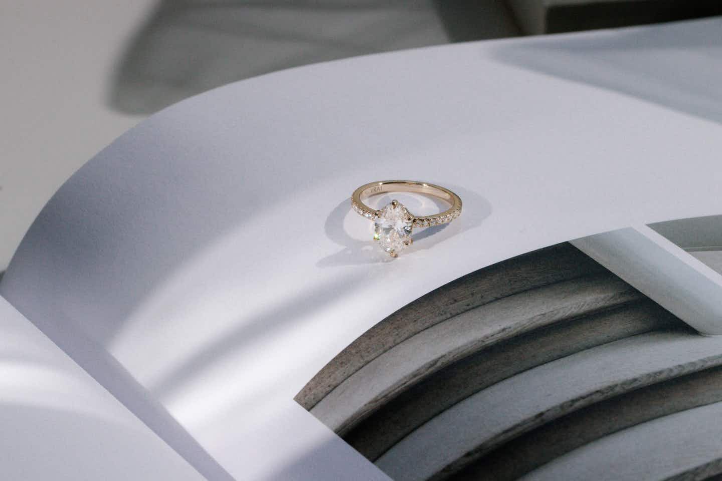 six prong engagement ring with a pave band