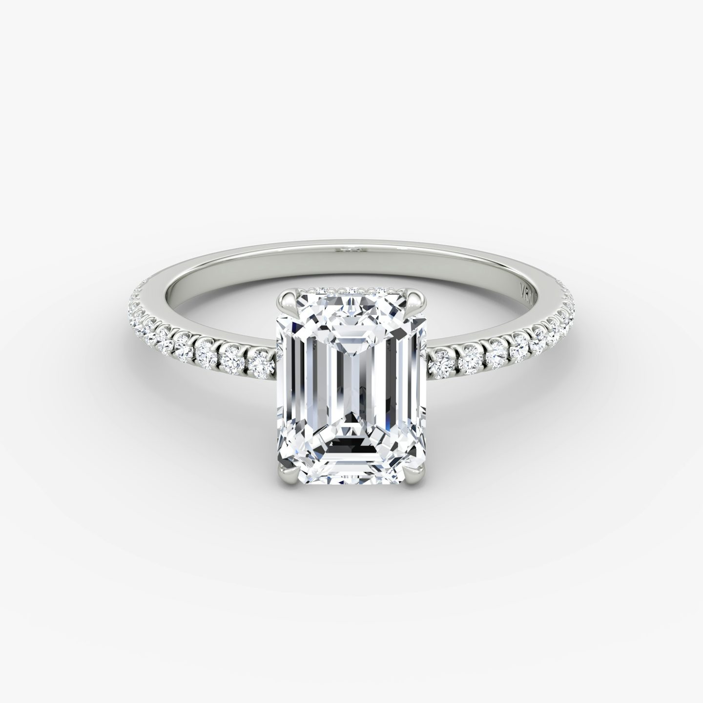 The Signature | Emerald | Platinum | Band: Pavé | Band width: Standard | Setting style: Hidden Halo | Diamond orientation: vertical | Carat weight: See full inventory