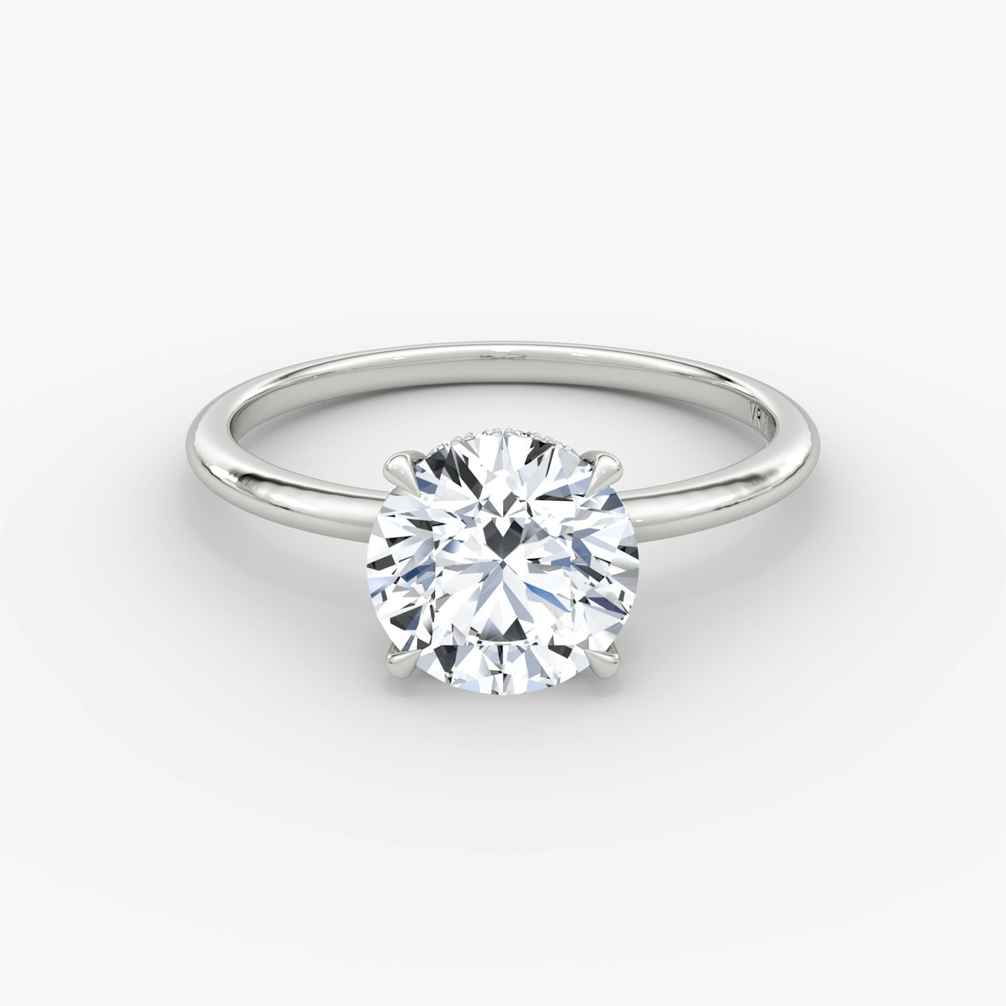 The Signature | Round Brilliant | Platinum | Band width: Standard | Band: Plain | Setting style: Hidden Halo | Carat weight: See full inventory | Diamond orientation: vertical