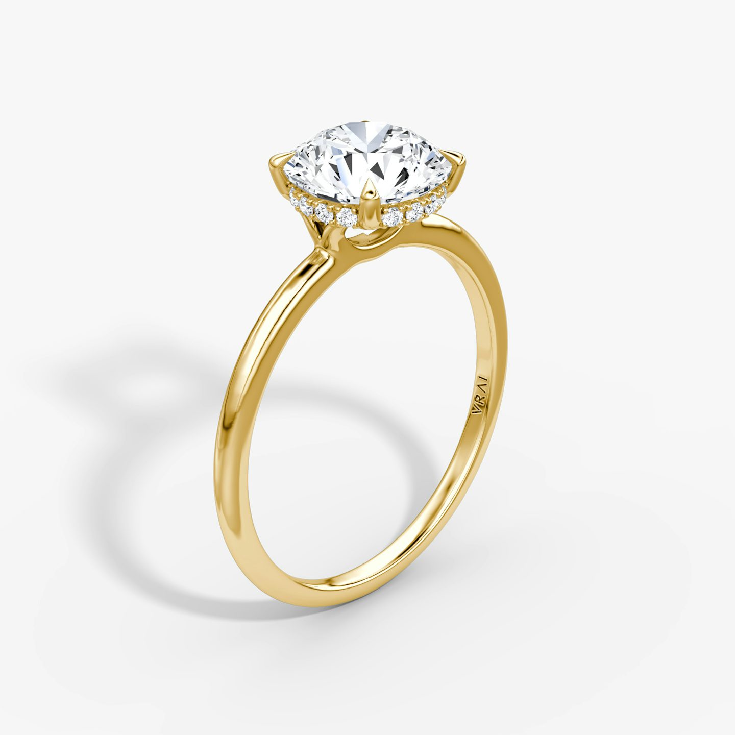 The Signature | Round Brilliant | 18k | 18k Yellow Gold | Band: Plain | Band width: Standard | Carat weight: See full inventory | Setting style: Hidden Halo | Diamond orientation: vertical