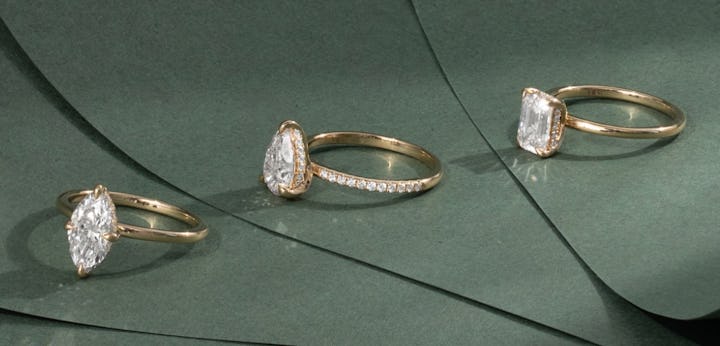 three made to order engagement rings with emerald cut, pear cut and marquise cut lab diamonds