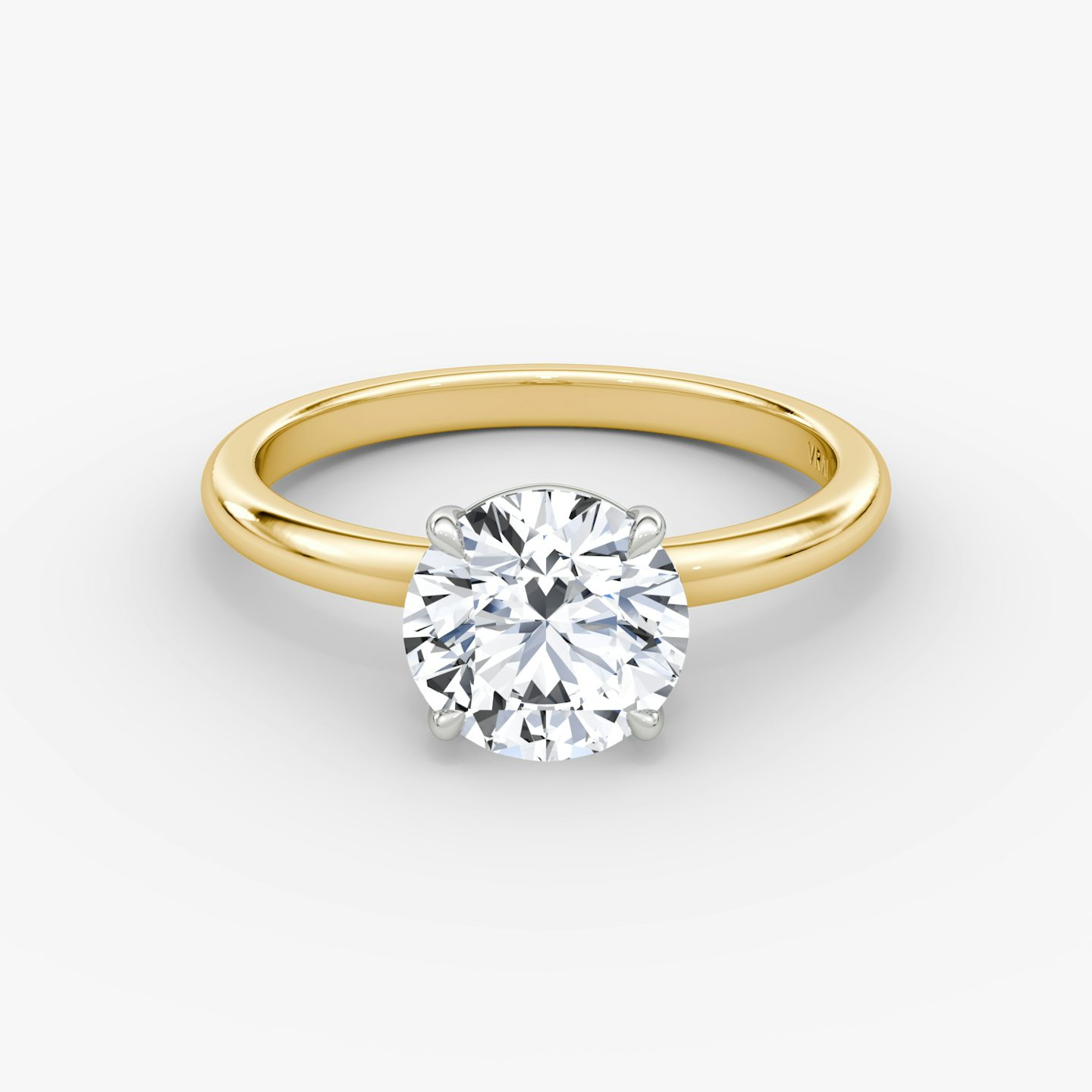 The Signature | Round Brilliant | 18k | 18k Yellow Gold and Platinum | Band width: Standard | Band: Plain | Setting style: Plain | Carat weight: See full inventory | Diamond orientation: vertical