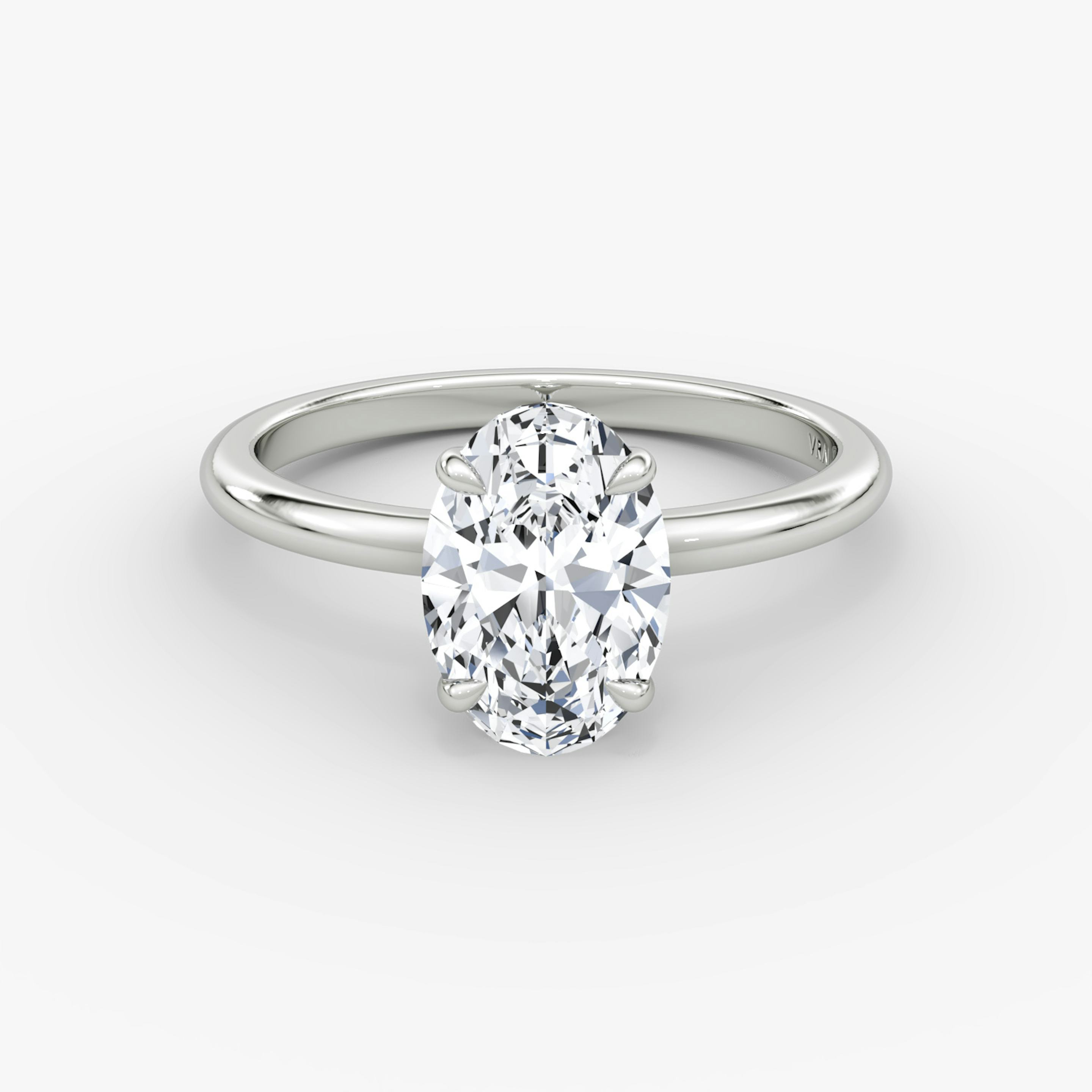 The Signature | Oval | Platinum | Band width: Standard | Band: Plain | Setting style: Plain | Diamond orientation: vertical | Carat weight: See full inventory