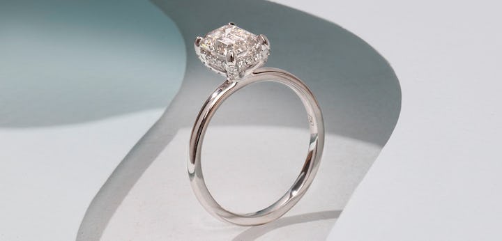 Solitaire engagement ring in platinum with a emerald cut lab grown diamond