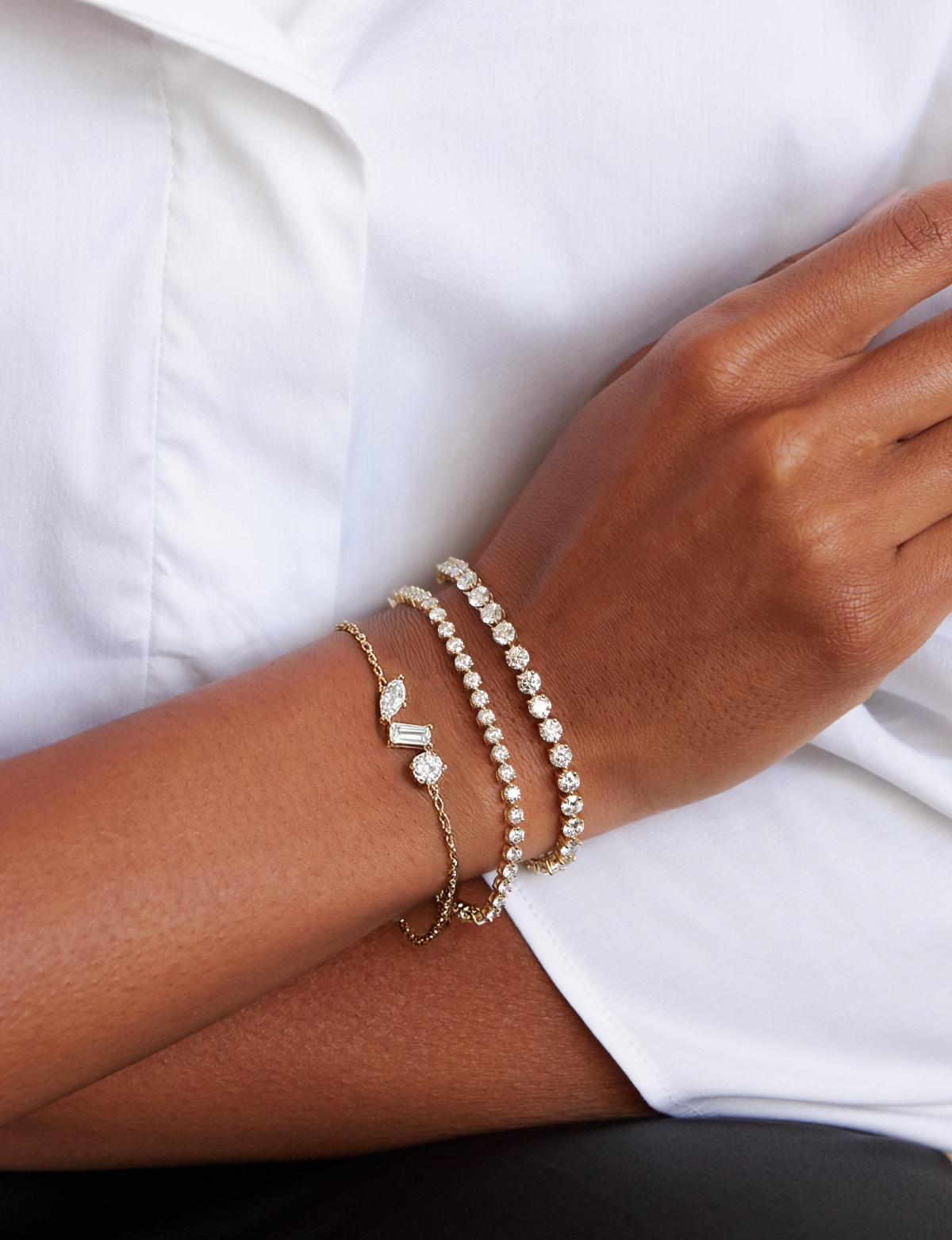 From brilliant tennis bracelets to more delicate designs, create a layered look that’s true to you.