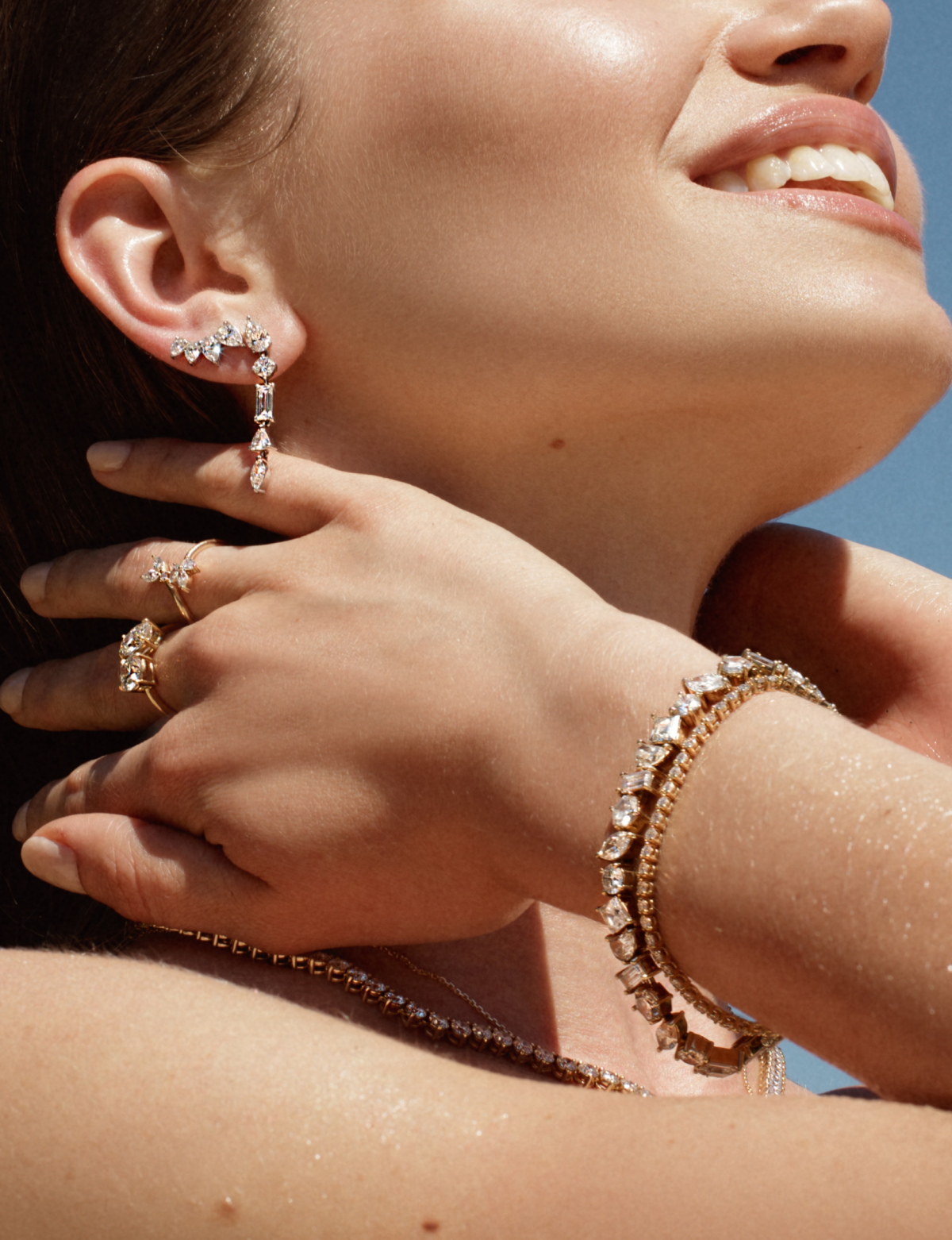 Mix drop earrings, hoops, and studs for daring summer style.