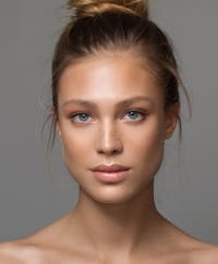 Beautiful woman with her hair in a bun