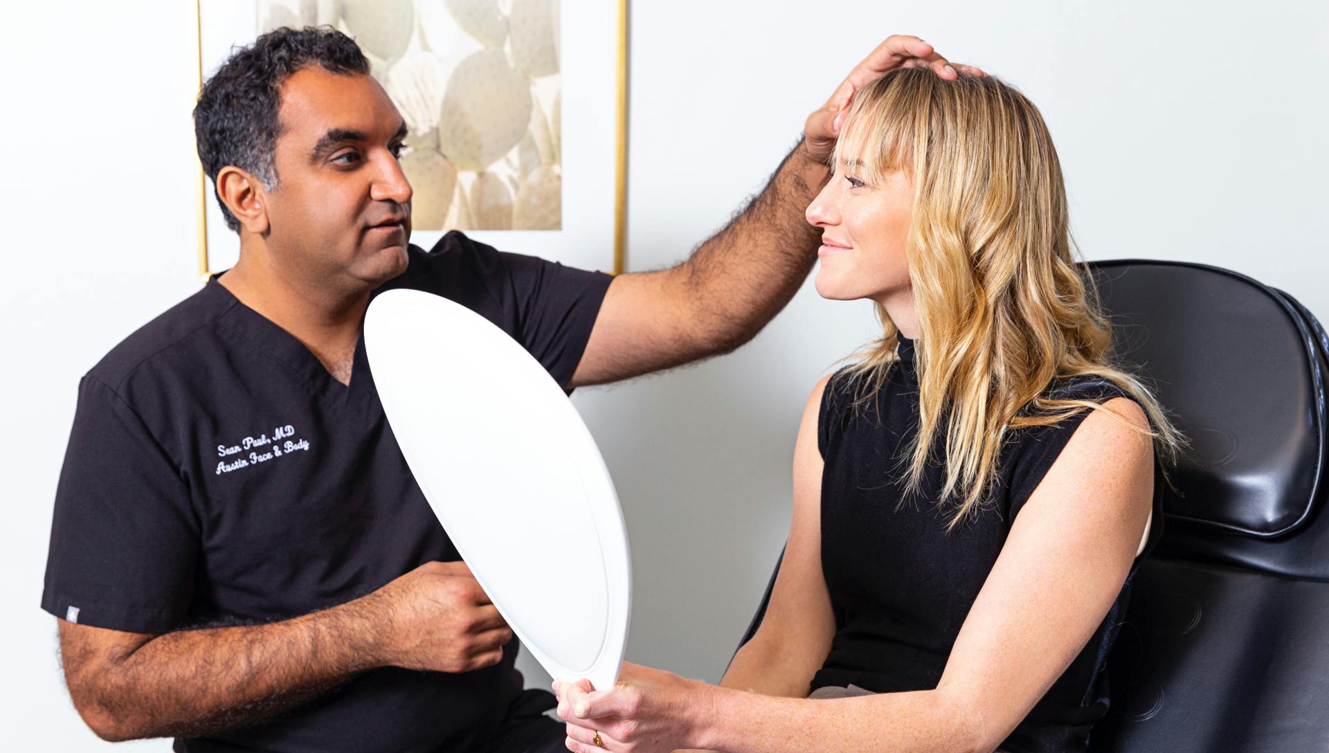 Dr. Sean Paul meeting with a female patient