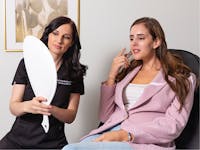 Dr. Lujan meeting with a female patient