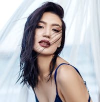 Attractive Asian woman wearing dark lipstick