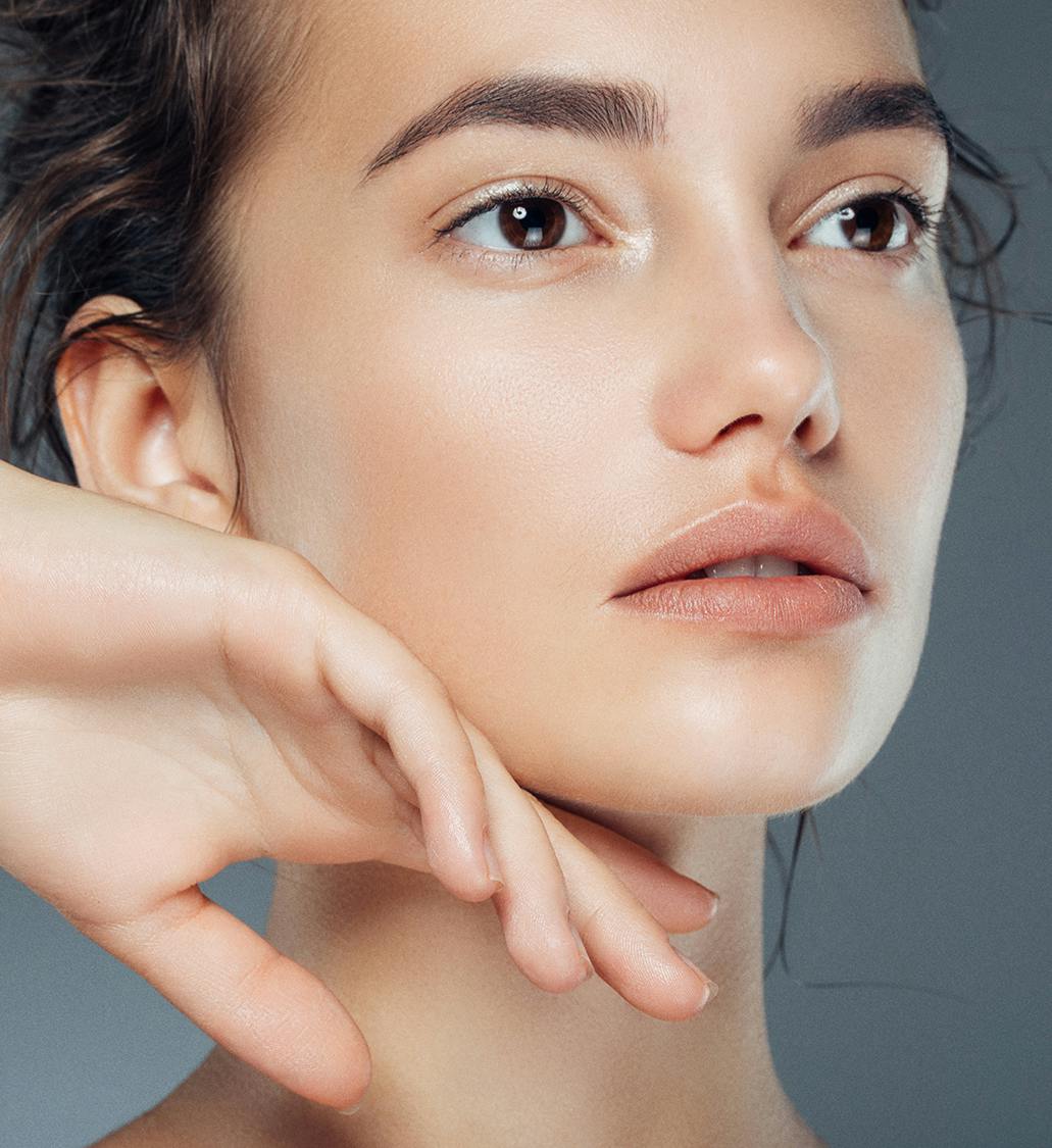 Woman touching her face