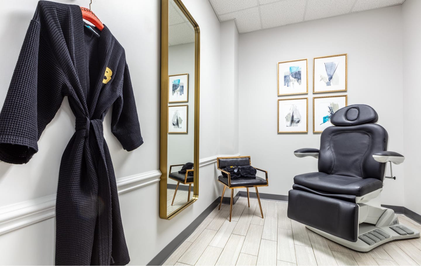 examine room with robe on wall