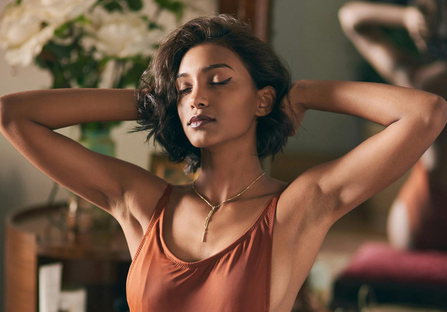 woman with her arms up