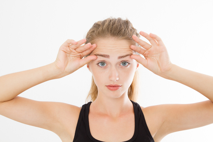 woman raising her eyebrows