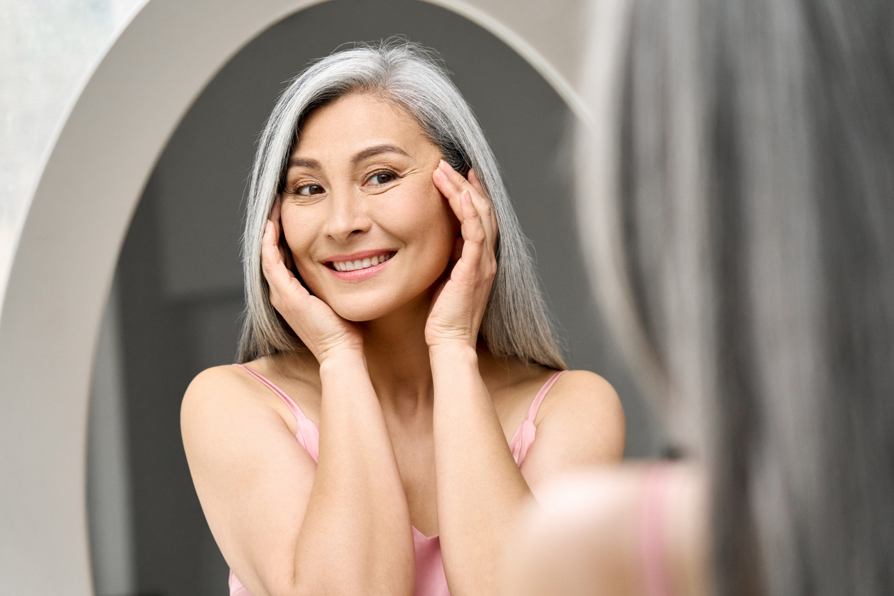 woman touching her face
