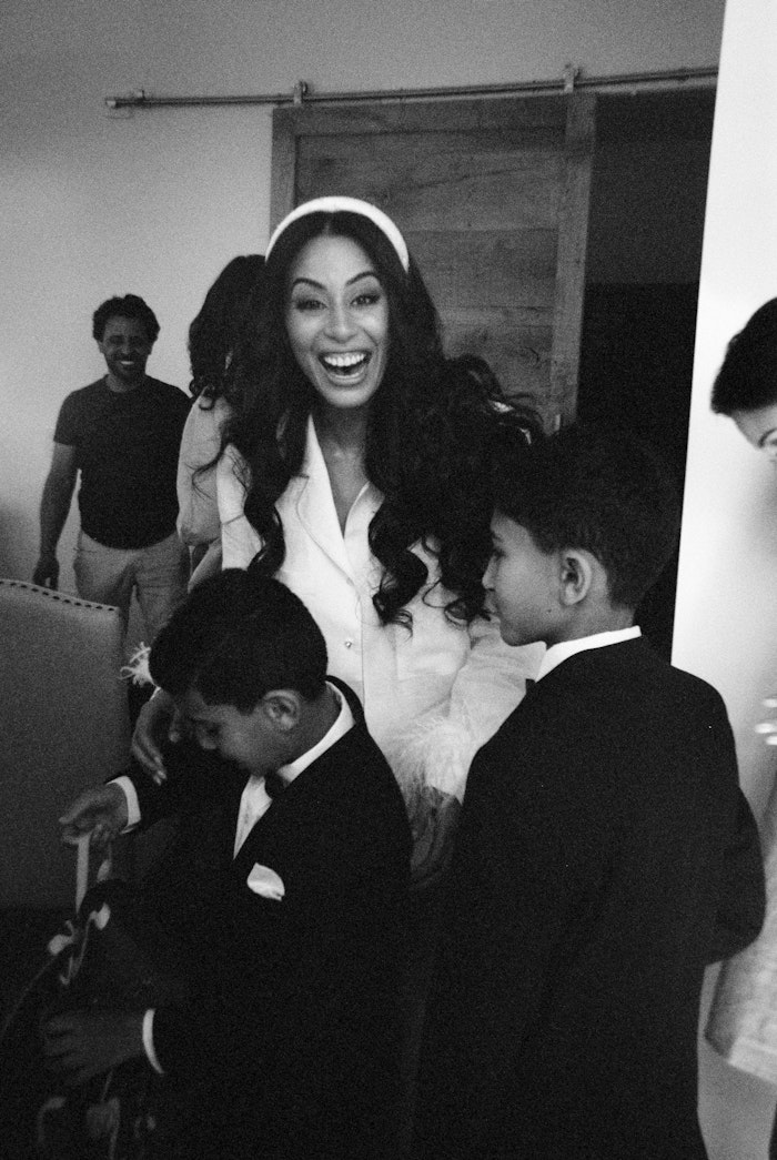 Photographed on film by Whitney heard in toronto, the bride is laughing and getting ready for her wedding with her friends.