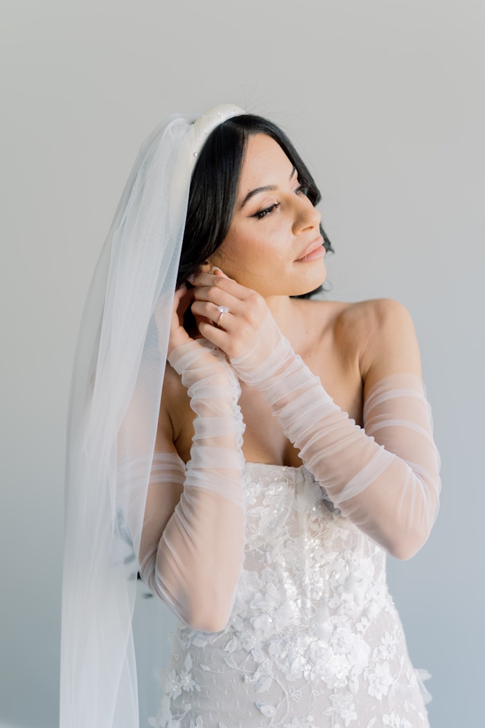 Egyptian Coptic bride in modern gown with sleves and veilat Globe and Mail Centre Toronto