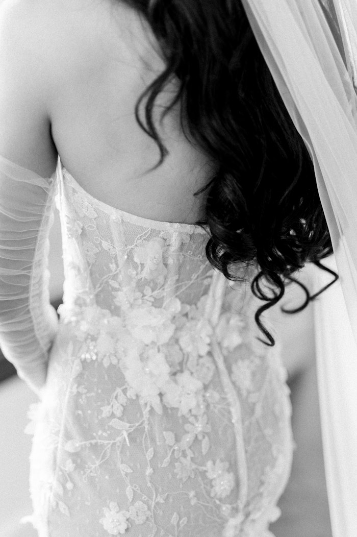 Toronto Top wedding photographer photographs the little details of an elegant wedding dress in black and white.