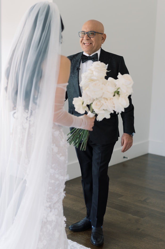 A raw moment when the father of the bride see's his daughter for the first time on the wedding day photographed by the best photographer in toronto.