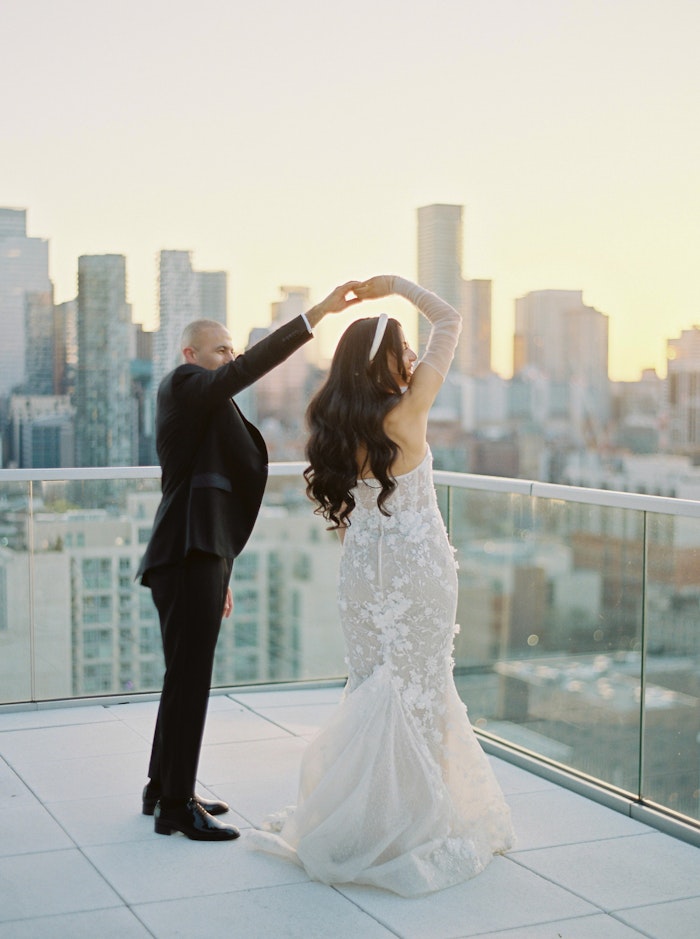 Bride and Groom dancing on the rooftop of the Globe and Mail Center in Toronto