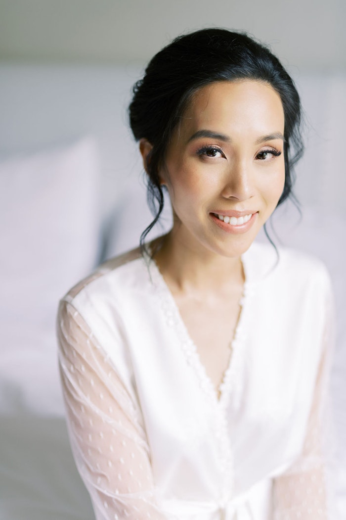Bride getting ready in natural window light at Spadina House Museum Toronto wedding morning