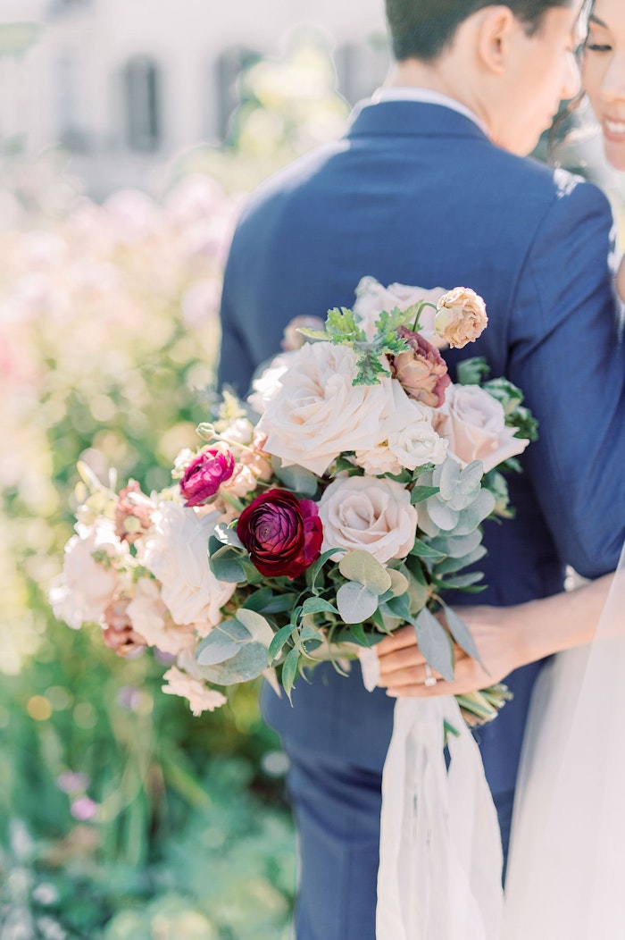 Romantic bridal bouquet with soft blush and blue tones at Spadina House Toronto wedding