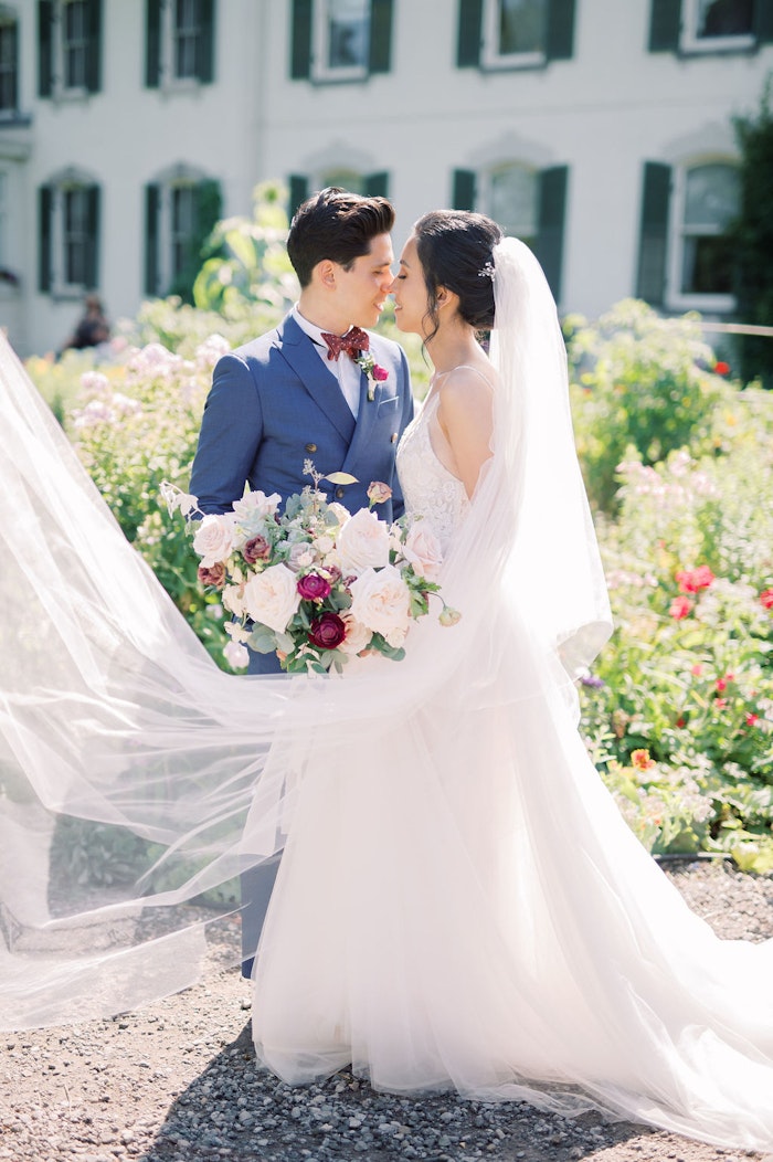 Bride and groom portraits in garden at Spadina House Museum Toronto wedding photographer