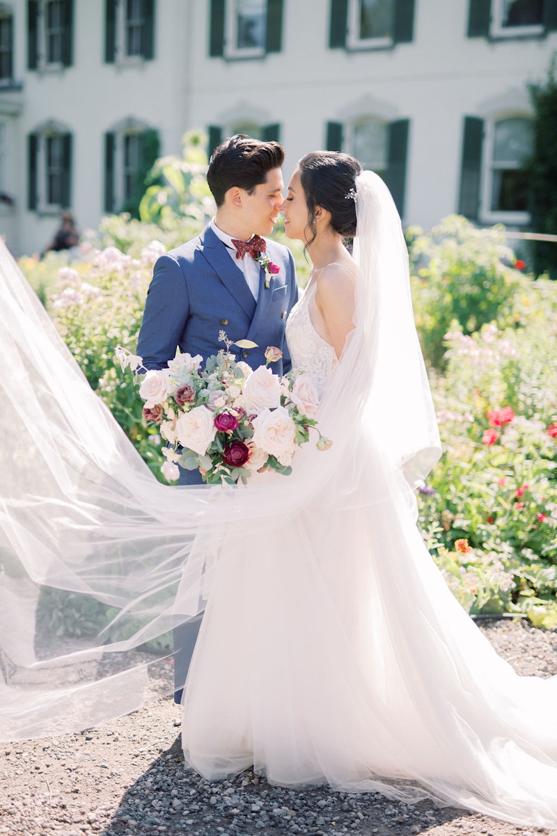 Bride and groom portraits in garden at Spadina House Museum Toronto wedding photographer