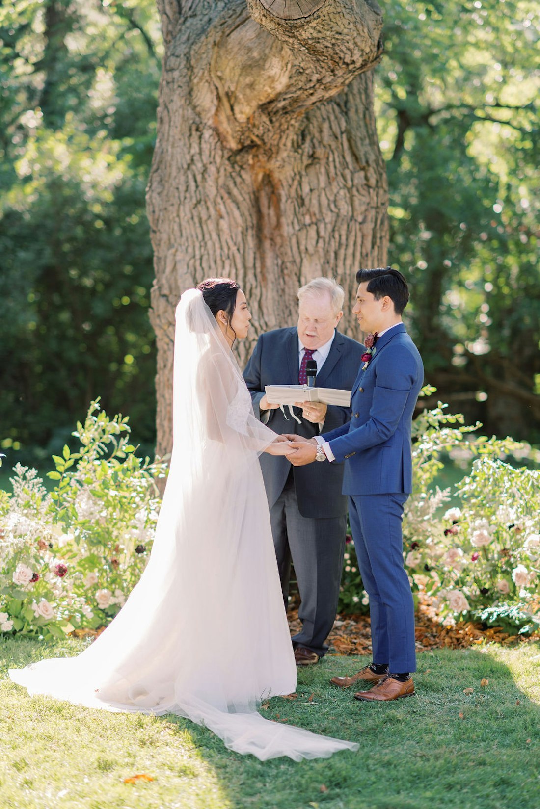Bride and groom standing at altar during outdoor ceremony at Spadina House Museum Toronto