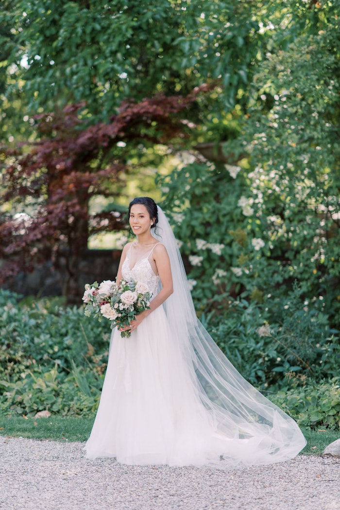 Bride and groom portraits in garden at Spadina House Museum Toronto wedding photographer