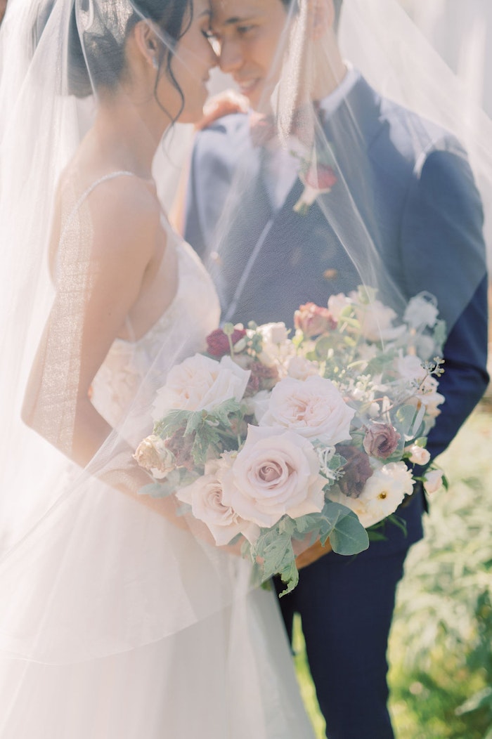 omantic bridal bouquet with soft blush and blue tones at Spadina House Toronto wedding