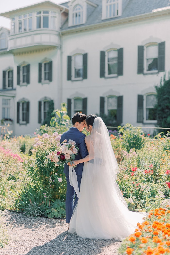 Bride and groom portraits in garden at Spadina House Museum Toronto wedding photographer