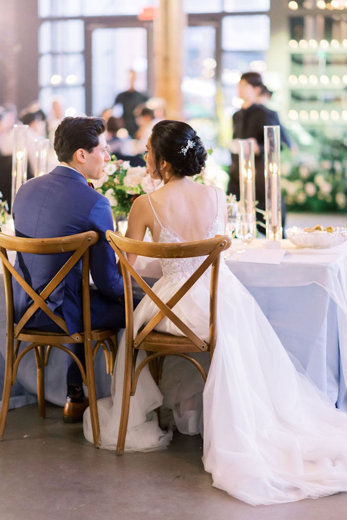 Bride and groom sharing a sweet moment during their wedding reception.