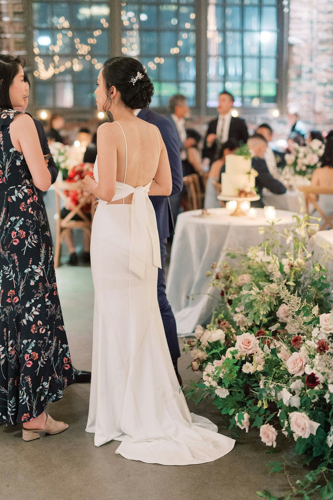 Reception atmosphere at Steam Whistle Roundhouse Toronto wedding with guests and soft lighting