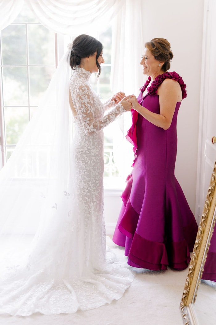 Emotional moment between bride and mother before ceremony