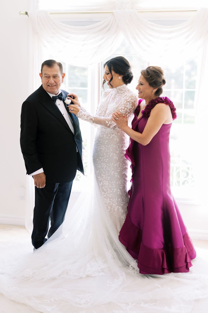 Quiet candid moment of bride with family before ceremony