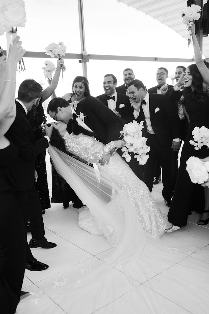 Black and white candid wedding party celebration moment