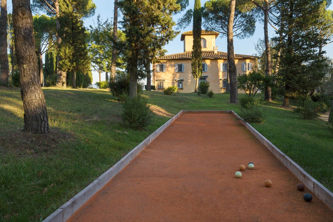 A pristine red clay court for bowls near Villa La Tavernaccia