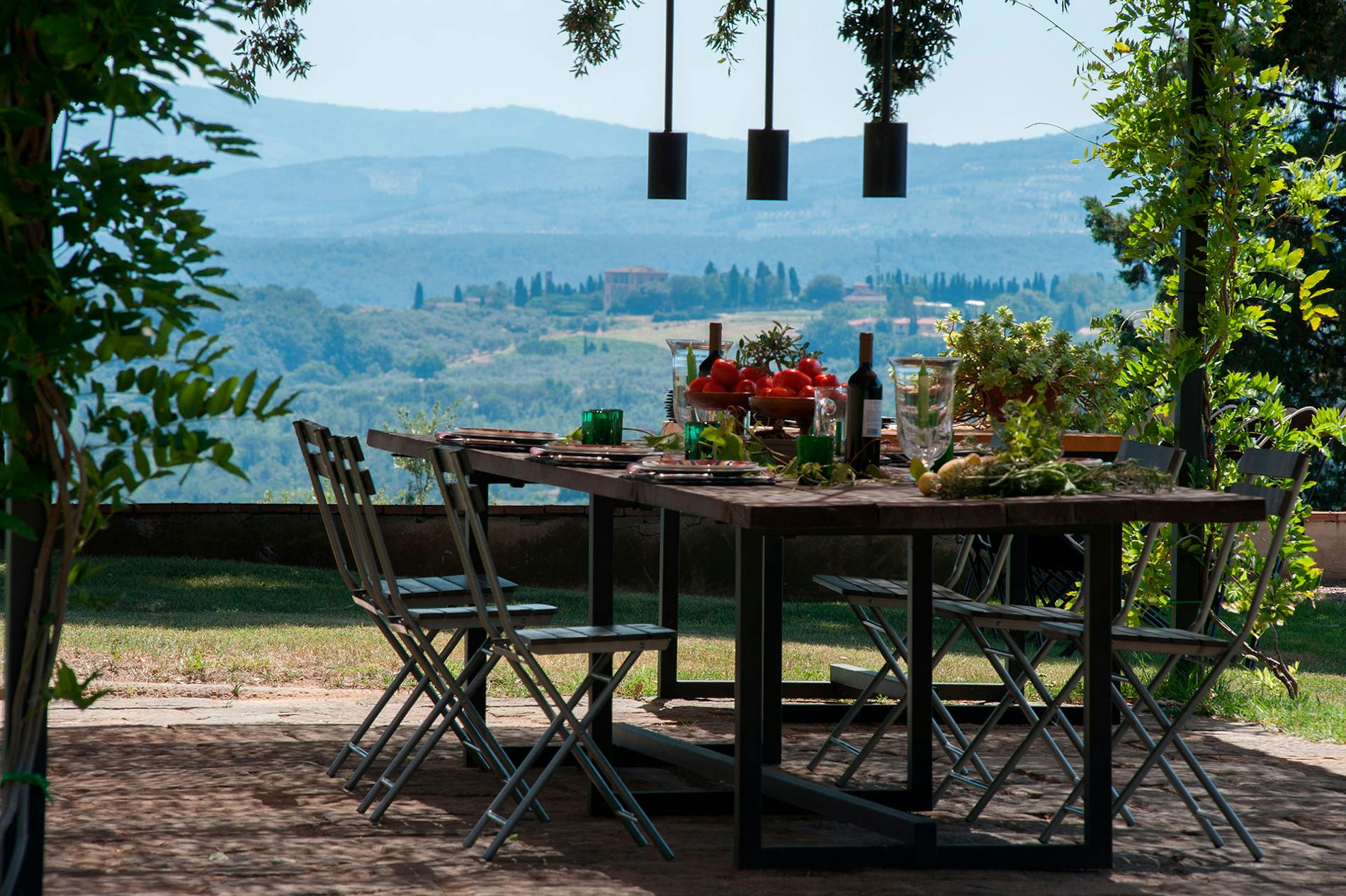 The veranda in Villa La Tavernaccia  The table under the veranda with the view on the Chianti hills.