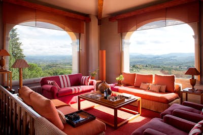 The living room in the tower of Villa Tavernaccia offers a 360-degree view of Florence and the Chianti Hills.