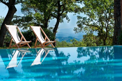 Two italian-designed seatings near the swimming pool